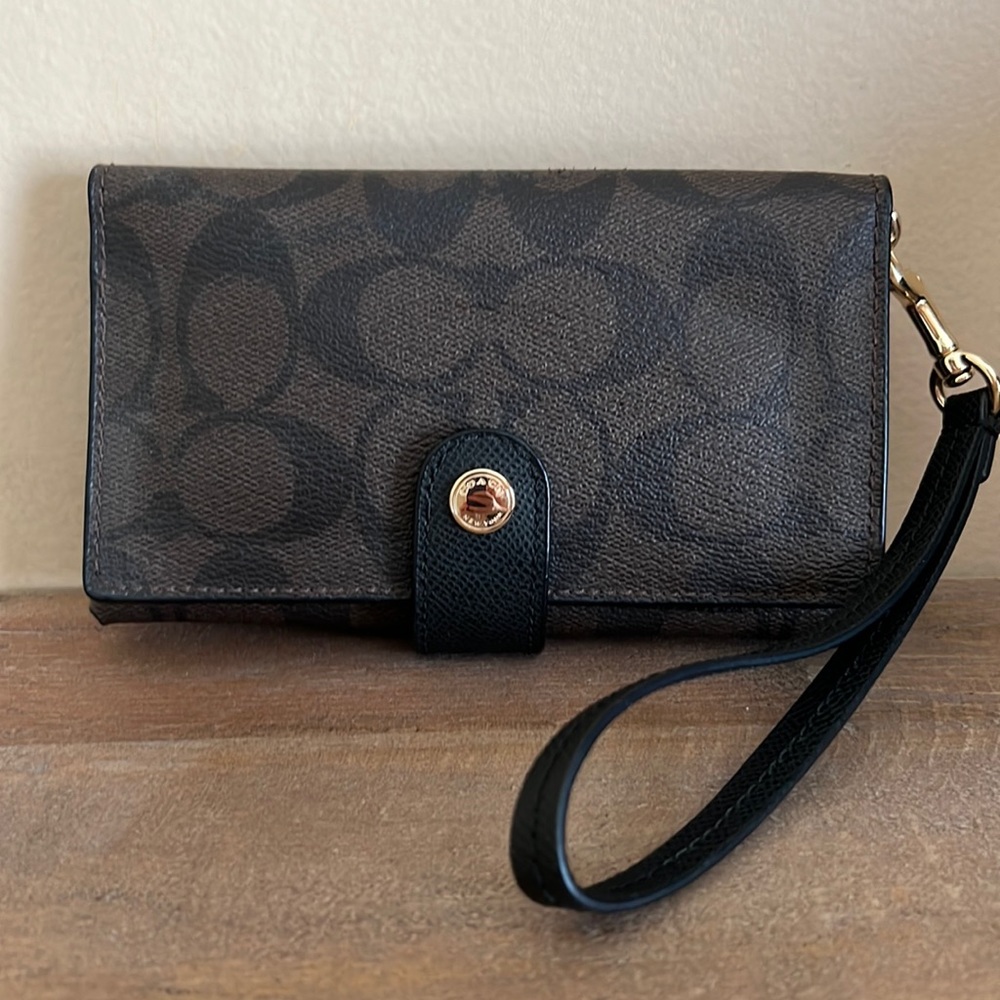 Coach wristlet/brown and black logo